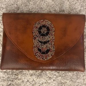 Brown leather clutch bag with a touch of maasai beads